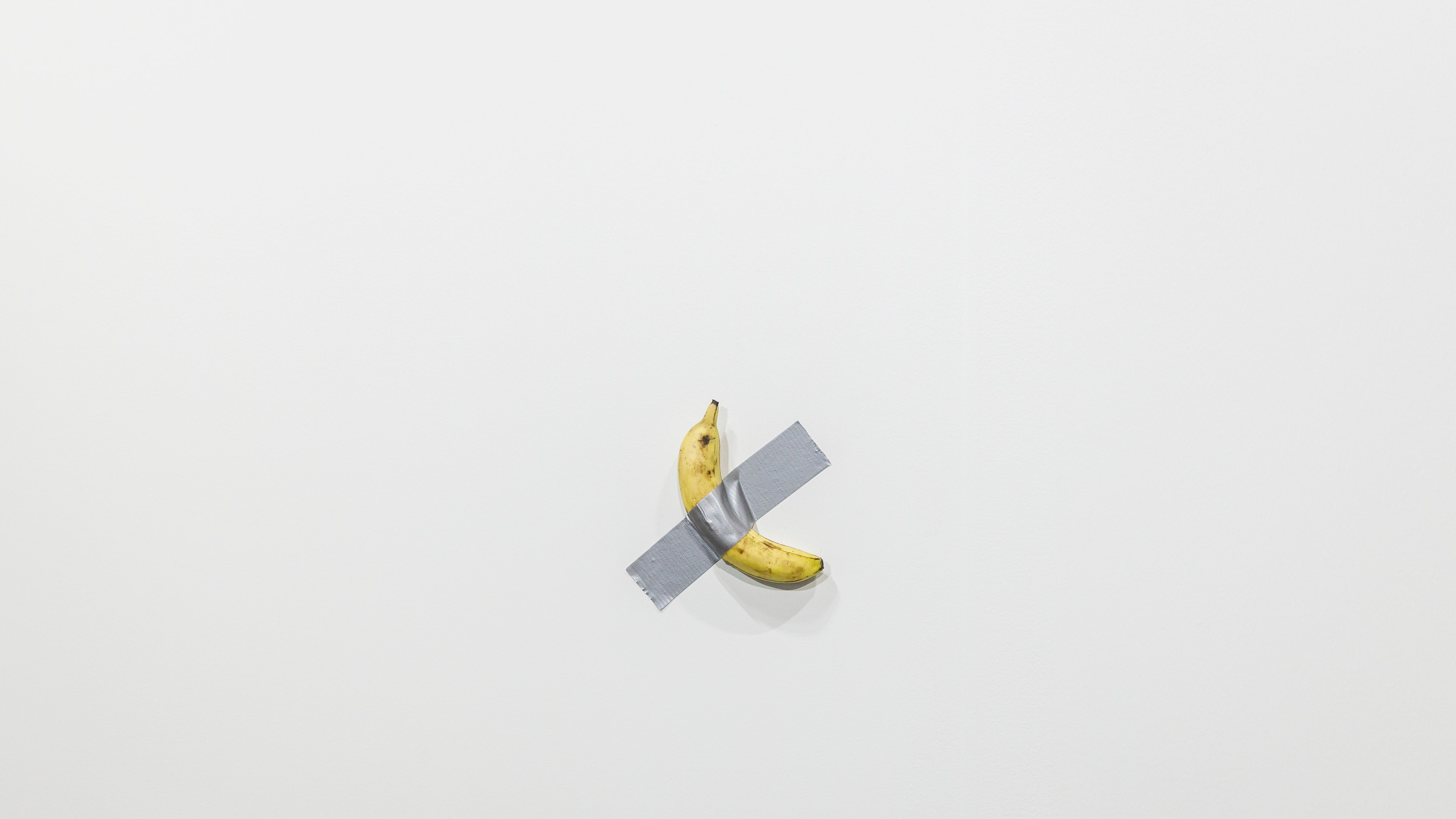 bannana taped to a wall